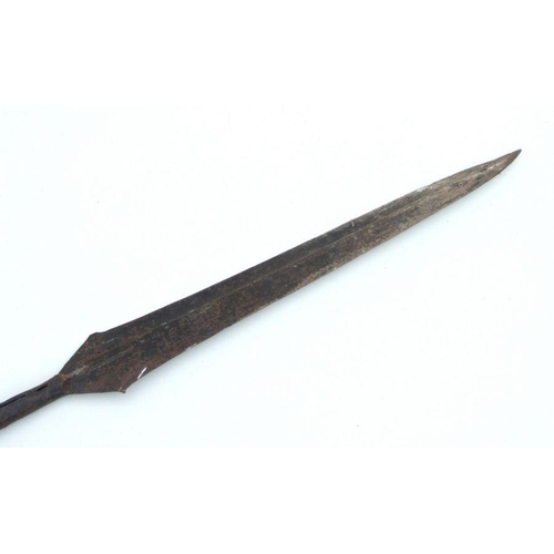 207 - An African tribal spear with leaf head and carved wooden shaft, 154cms long.