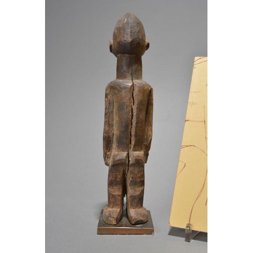 213 - A Lobi standing female figure, Burkina Faso with a centrally ridged head and well defined features,2... 