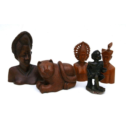 223 - A group of African and Asian carved wooden busts and similar items, the largest 42cms high (9).