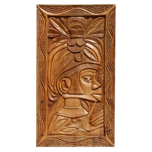 224 - A carved wooden panel depicting an Asian figure wearing a headdress, 43 by 76cms.