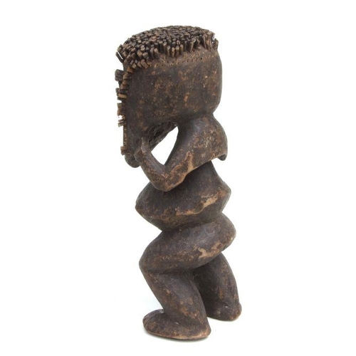 226 - African Art / Tribal Art:  a carved wooden Mambila (Cameroons) male figure, 36cms high.