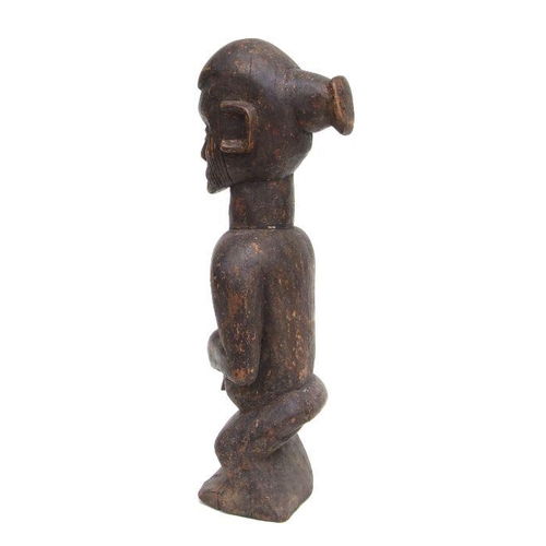 230 - African Art / Tribal Art:  a carved wooden Teke / Yanzi male figure, 52cms high.