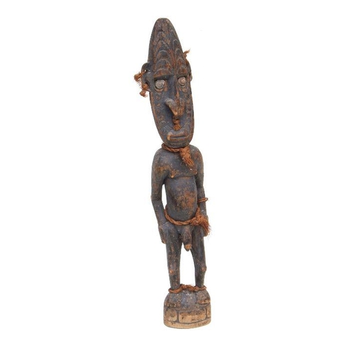 231 - Oceanic Art / Tribal Art:  a carved wooden PNG Sepik male ancestor figure, 53cms high.