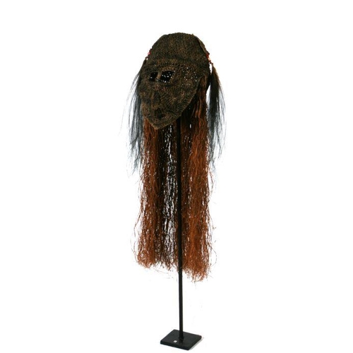 241 - Oceanic / Tribal Art:  a Papua New Guinea woven fibre headdress with cassowary feathers, on stand, 1... 