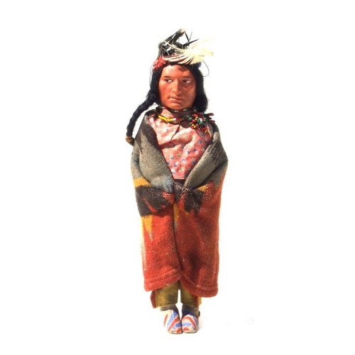 243 - North American / Tribal Art:  an early 20th century Native American Skookum doll with painted compos... 