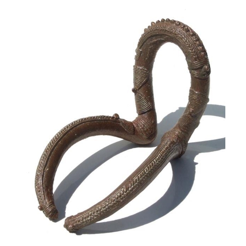 245 - African Art / Tribal Art:  a Chad bronze Kenga armlet with overall decoration, 18cms long.