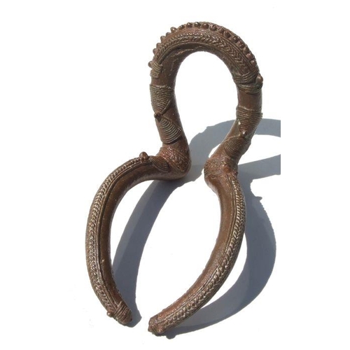 245 - African Art / Tribal Art:  a Chad bronze Kenga armlet with overall decoration, 18cms long.