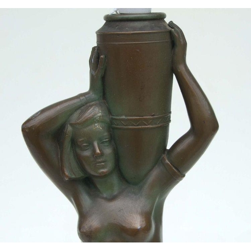 260 - An Art Deco bronzed spelter table lamp in the form of a naked girl carrying an urn, on a marble base... 