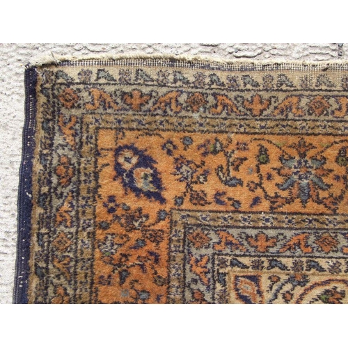 300 - A Turkish hand knotted woollen rug, the central gul within stylised floral borders, on a beige groun... 