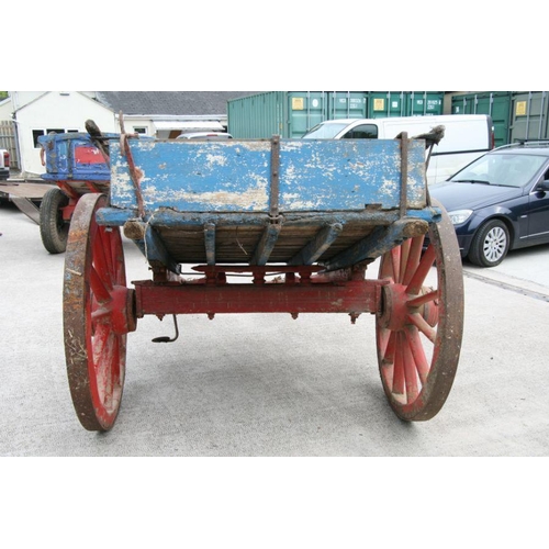 4 - A traditional horse drawn tipping cart with wooden shafts, steel and wooden cartwheels and bears pla... 