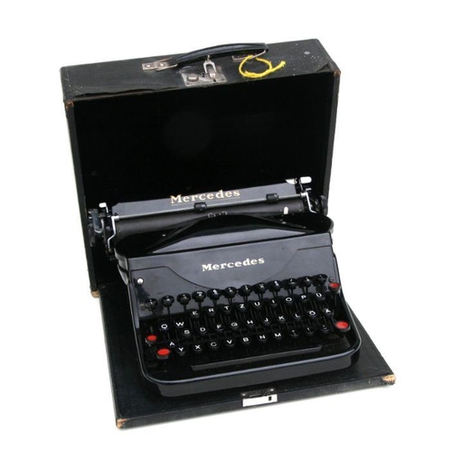 410 - A vintage Mercedes portable typewriter.