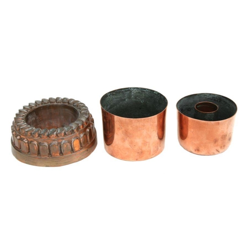 414 - A group of three 19th century copper jelly moulds, the largest 16cms diameter (3).