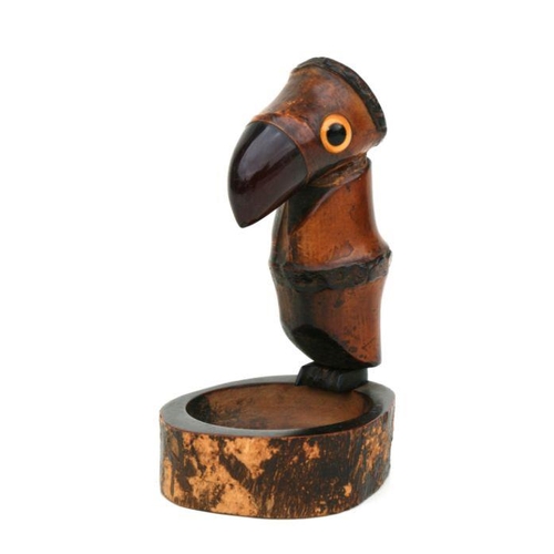 415 - An Art Deco wood and bamboo novelty ashtray in the form of a bird with a cherry amber Bakelite beak,... 