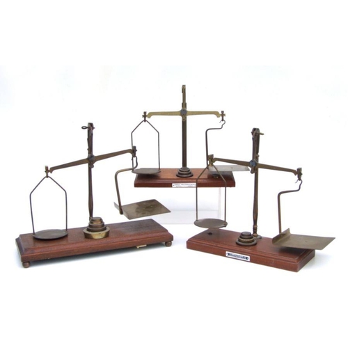 478 - A De Grave & Co. brass and mahogany GPO balance scales and, 33cms wide; together with two simila... 