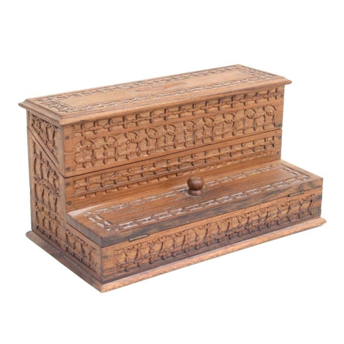 480 - A carved hardwood table top stamp box, 25cms wide.