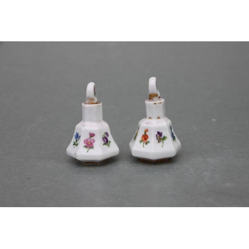 65 - A pair of late 19th century Meissen miniature scent bottles & stoppers decorated with flowers an... 