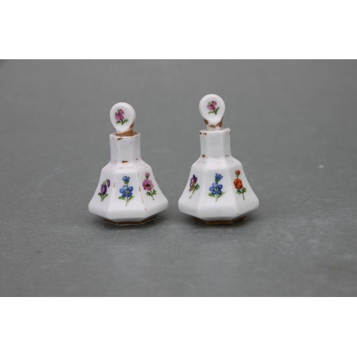 65 - A pair of late 19th century Meissen miniature scent bottles & stoppers decorated with flowers an... 