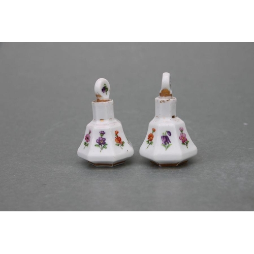 65 - A pair of late 19th century Meissen miniature scent bottles & stoppers decorated with flowers an... 