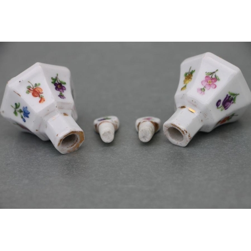 65 - A pair of late 19th century Meissen miniature scent bottles & stoppers decorated with flowers an... 