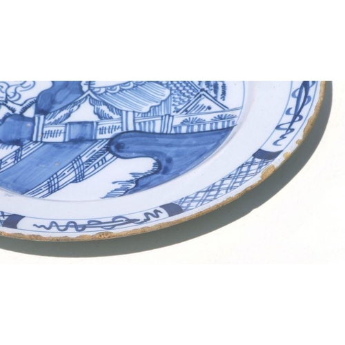 71 - A pair of Delft blue & white plates with unusual landscape scenes depicting a tent beside a tree... 