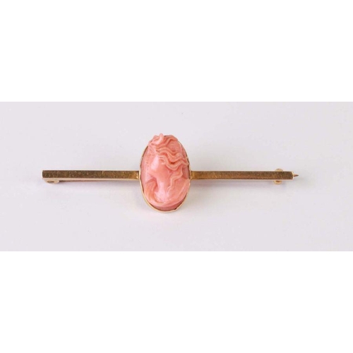 756 - A 14ct gold carved coral cameo bar brooch, 5cms wide.