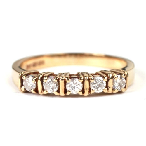 767 - A 9ct gold five-stone diamond ring, approx UK size 'M', 2.6g.