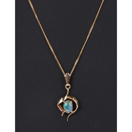 769 - A yellow metal pendant set with an oval opal cabochon on an 18ct gold chain (chain weight 2.3g).