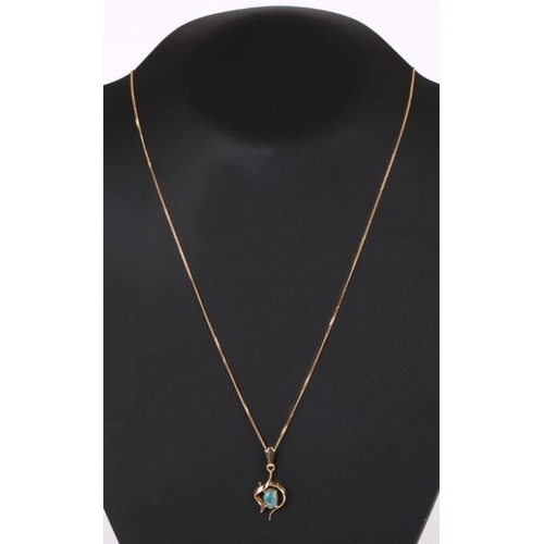 769 - A yellow metal pendant set with an oval opal cabochon on an 18ct gold chain (chain weight 2.3g).