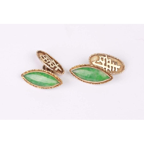 774 - A pair of Chinese 18ct gold and jade cufflinks of navette form.