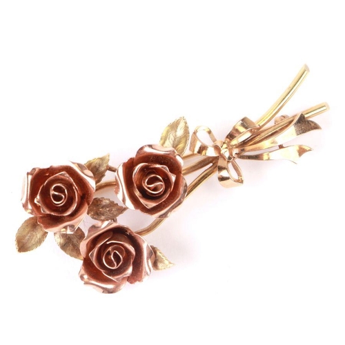 780 - A 14ct rose gold and yellow gold brooch in the form of a spray of roses, 6cms long, 12.7g.