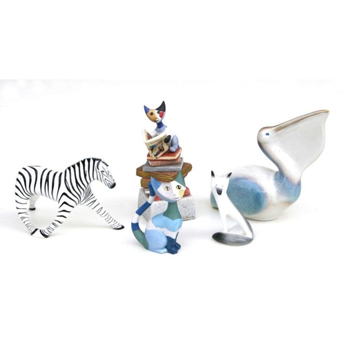 91 - A Goebel pelican, 23cms high; together with a stylised Goebel cat; a Goebel stylised cat; a Cmielow ... 