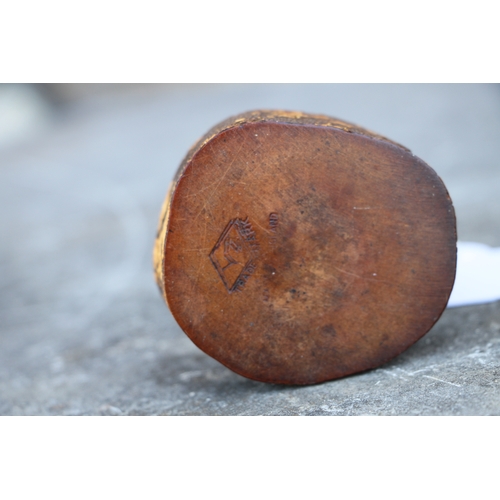 415 - An Art Deco wood and bamboo novelty ashtray in the form of a bird with a cherry amber Bakelite beak,... 