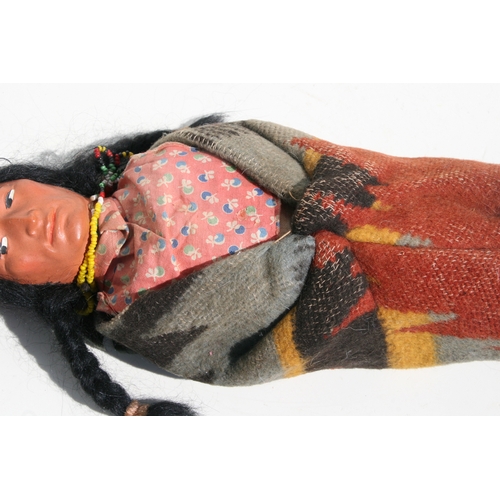 243 - North American / Tribal Art:  an early 20th century Native American Skookum doll with painted compos... 