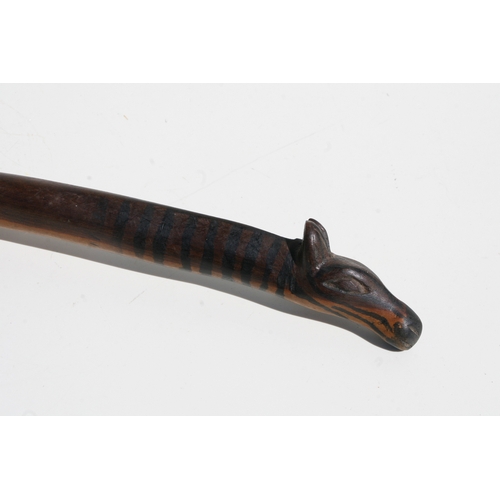 244 - Tribal Art:  an African Zulu / Tsonga zebra spoon, 31cms long; together with a Native American knife... 