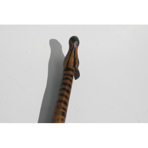 244 - Tribal Art:  an African Zulu / Tsonga zebra spoon, 31cms long; together with a Native American knife... 