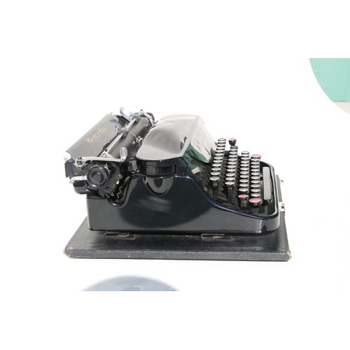 410 - A vintage Mercedes portable typewriter.