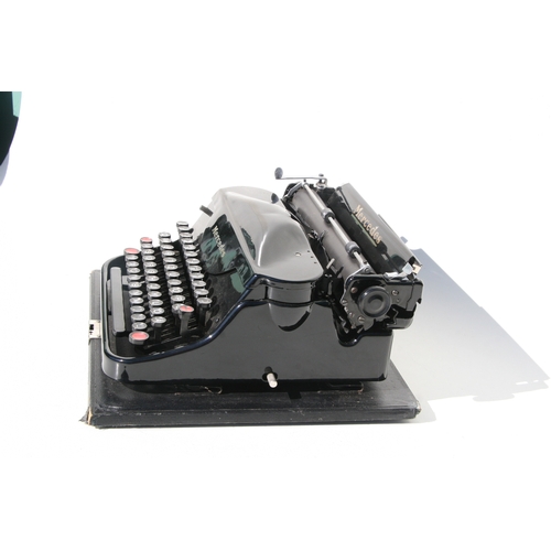 410 - A vintage Mercedes portable typewriter.