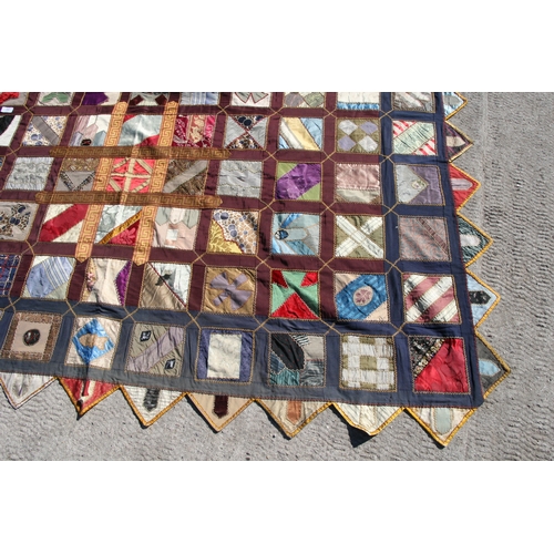 282 - A patchwork wall hanging, 135 by 198cms.