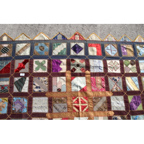 282 - A patchwork wall hanging, 135 by 198cms.