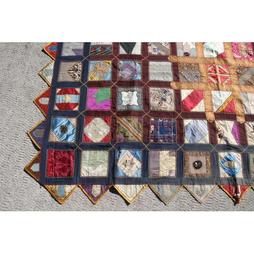 282 - A patchwork wall hanging, 135 by 198cms.