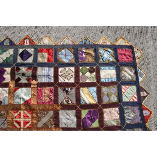 282 - A patchwork wall hanging, 135 by 198cms.