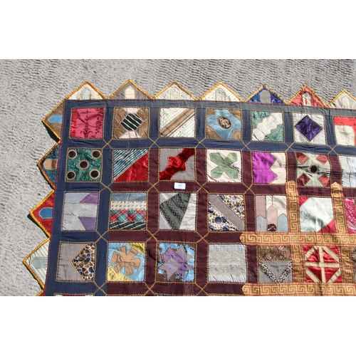 282 - A patchwork wall hanging, 135 by 198cms.