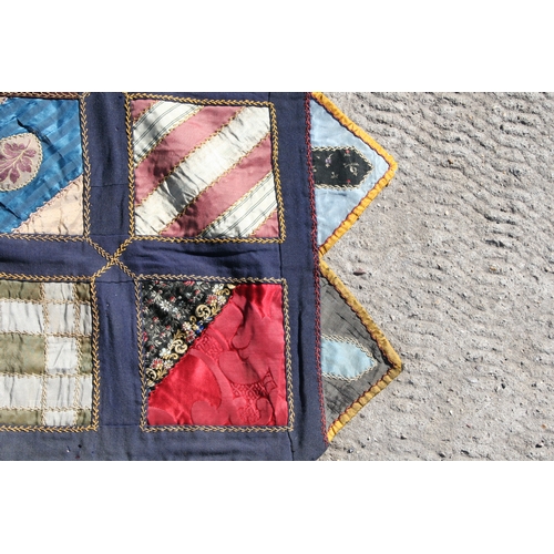 282 - A patchwork wall hanging, 135 by 198cms.