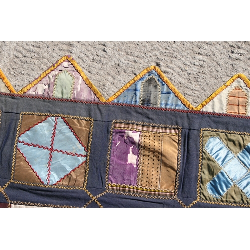 282 - A patchwork wall hanging, 135 by 198cms.