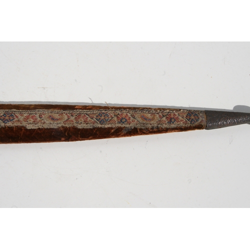 112 - A 19th century rhino horn handled North African Kijal dagger, 43cms long.