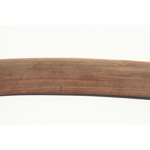 199 - An Australian Aboriginal boomerang with simple decoration, 77cms long.