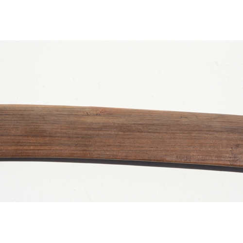 199 - An Australian Aboriginal boomerang with simple decoration, 77cms long.