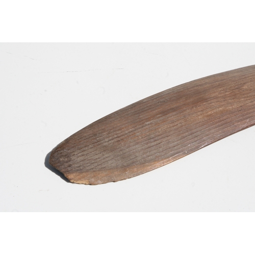 199 - An Australian Aboriginal boomerang with simple decoration, 77cms long.