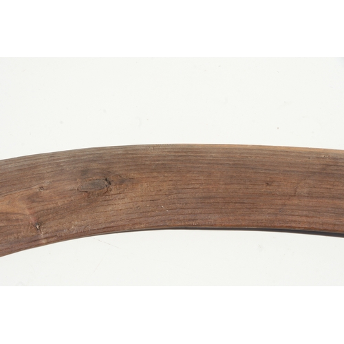 199 - An Australian Aboriginal boomerang with simple decoration, 77cms long.