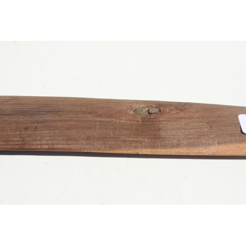 199 - An Australian Aboriginal boomerang with simple decoration, 77cms long.